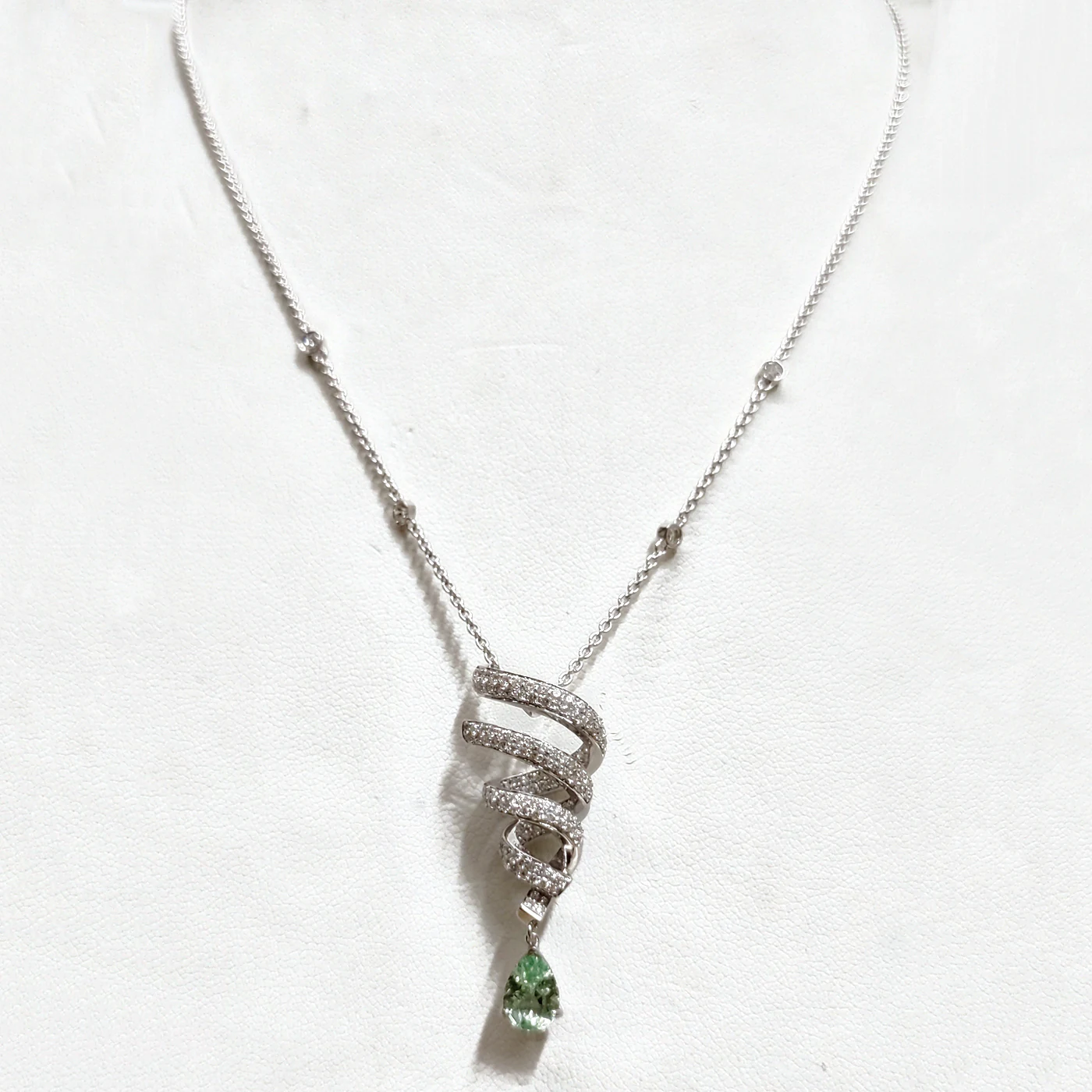 Mint garnet and diamond swirl pendant