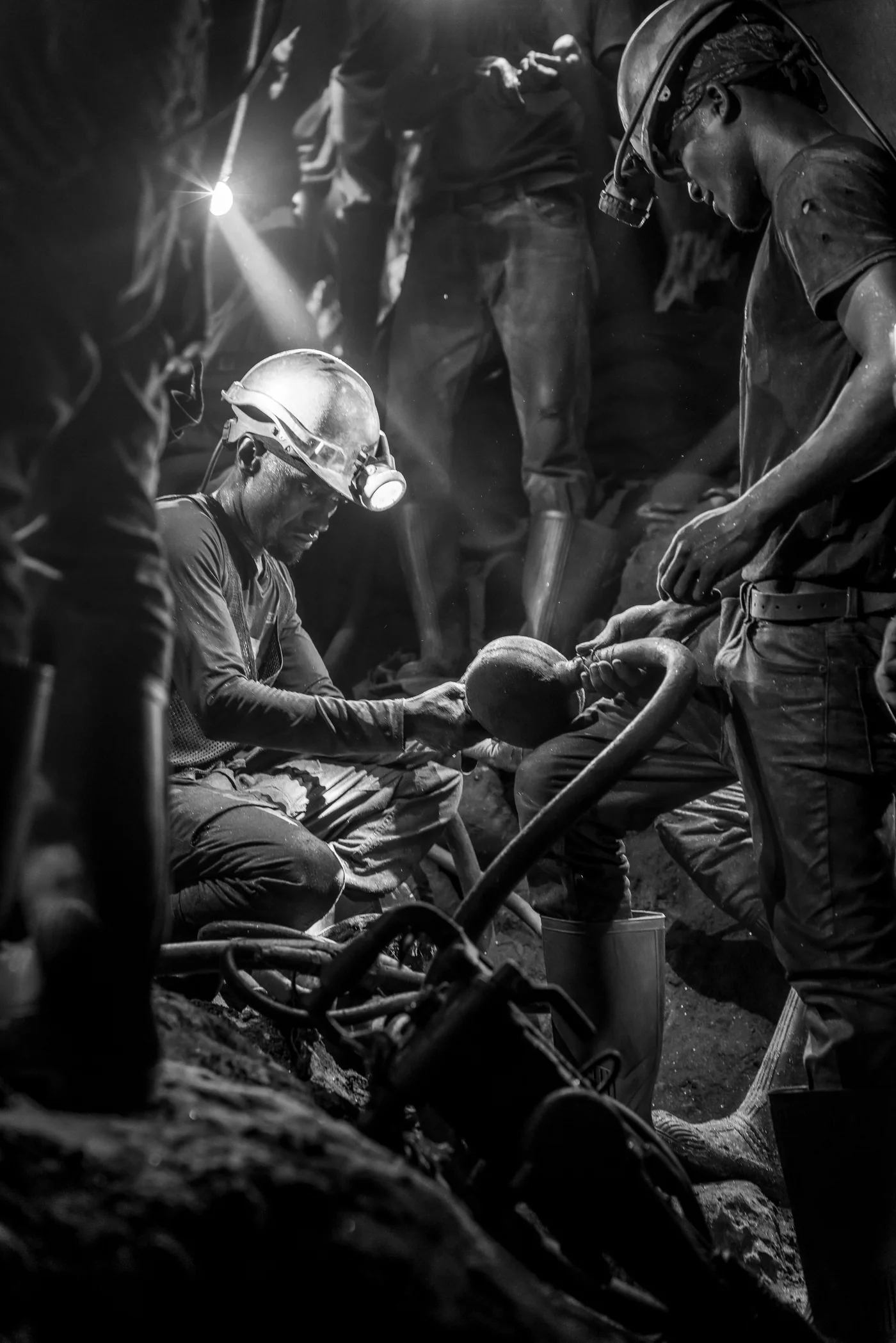 Miners at work underground in Tanzania.