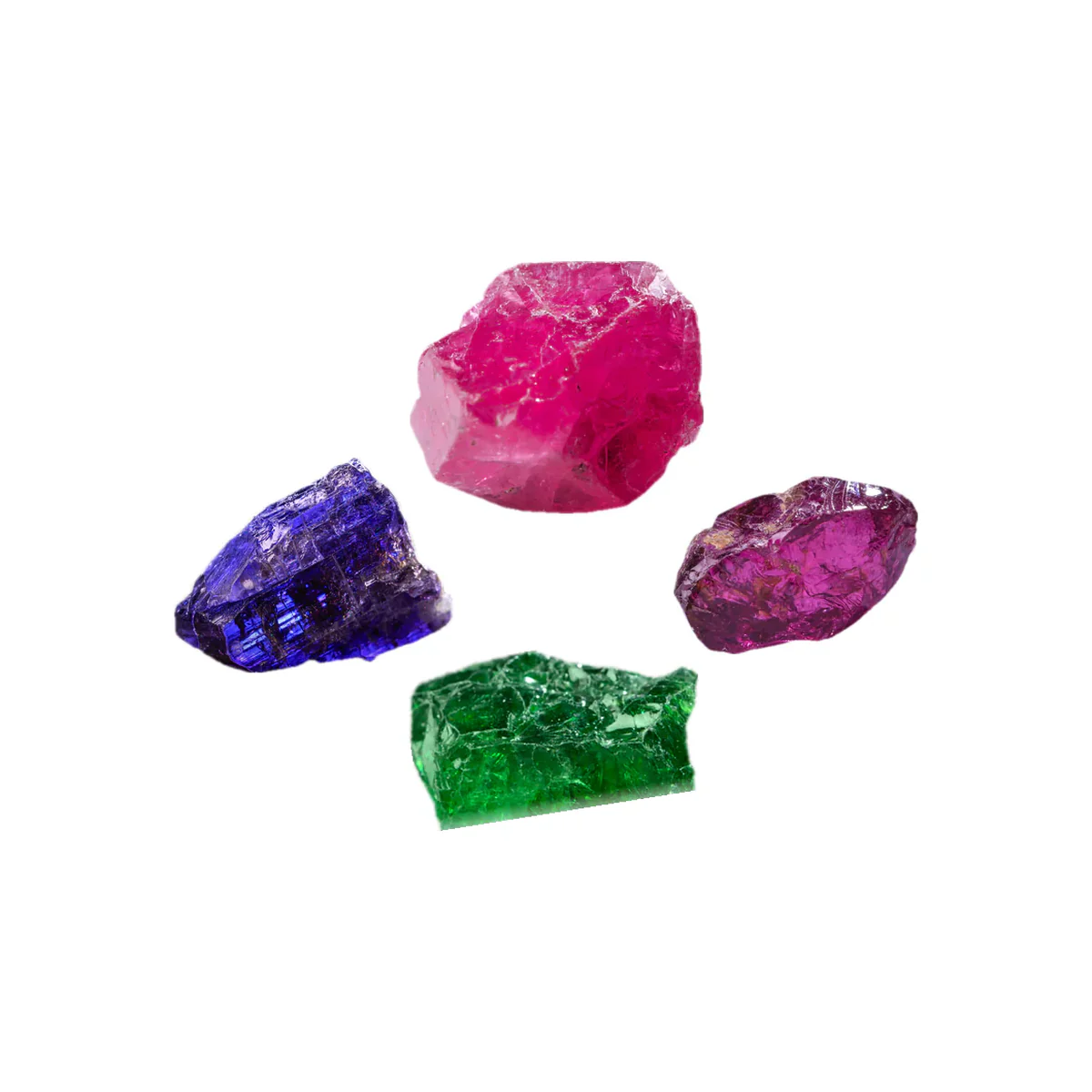 Rough spinel, tanzanite, rhodolite and tsavorite, as they come from the ground.