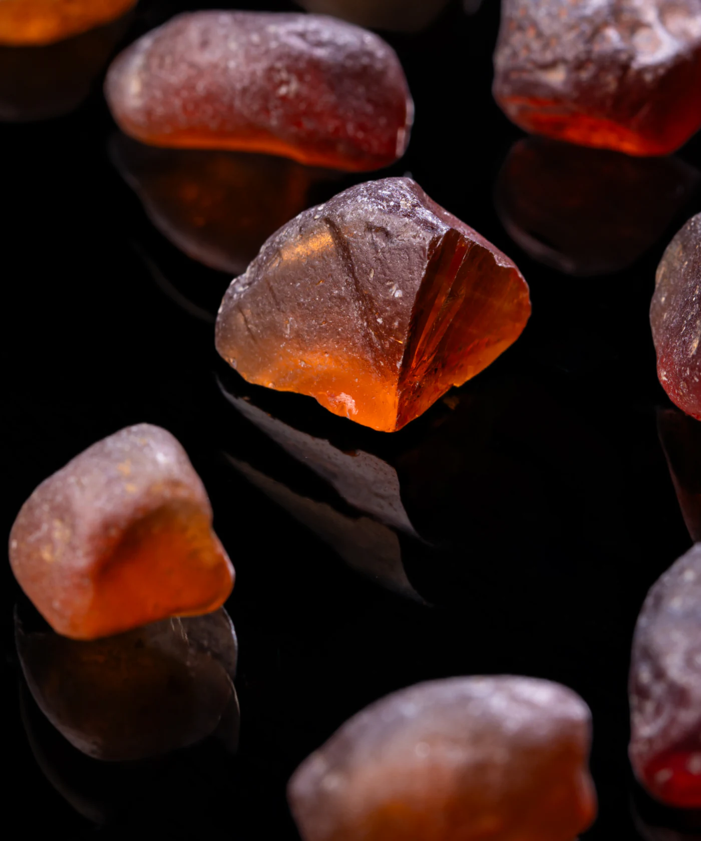 Rough Malaya garnet on black.