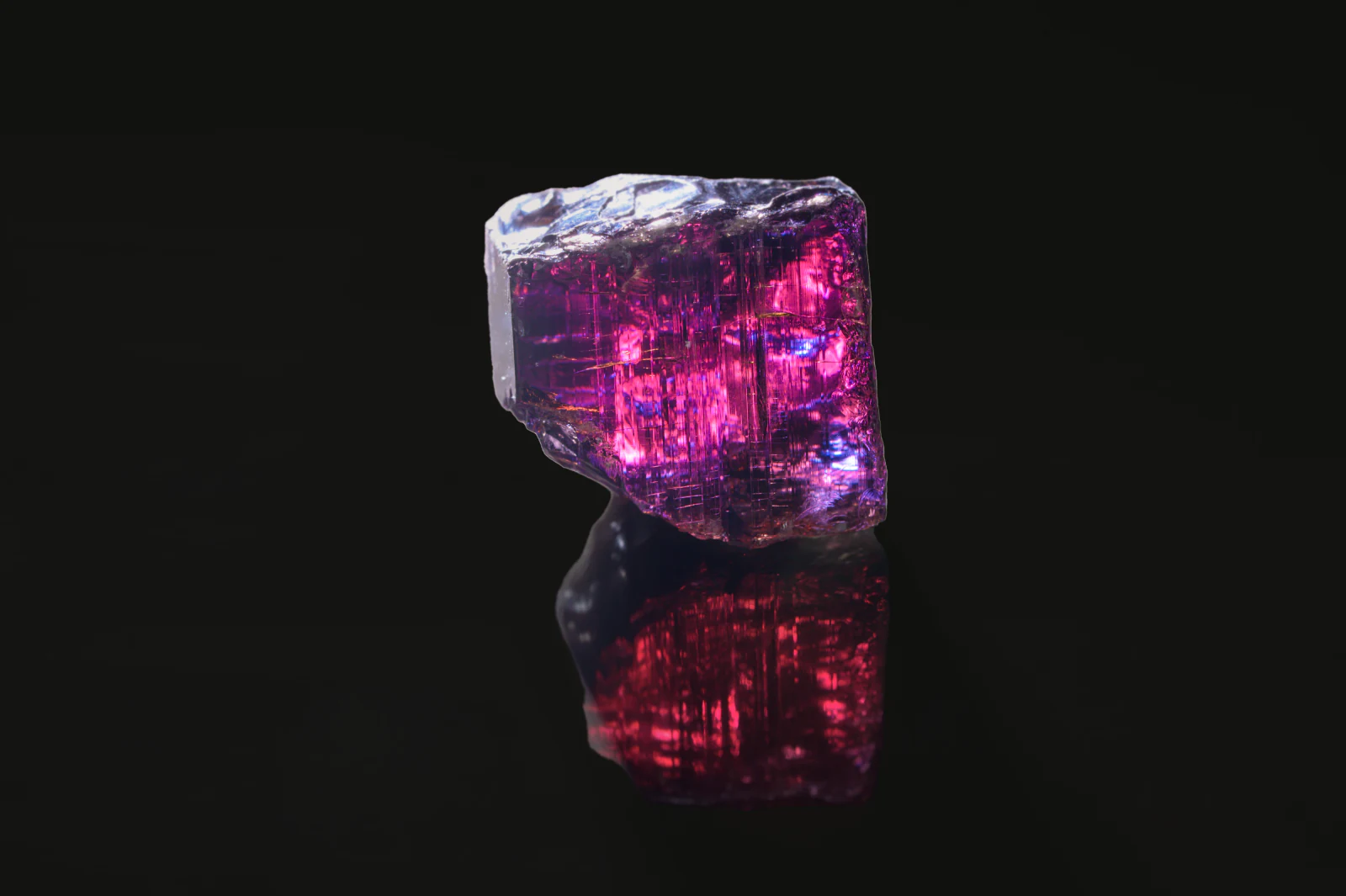 A rough tanzanite turned to show its burgundy colour.
