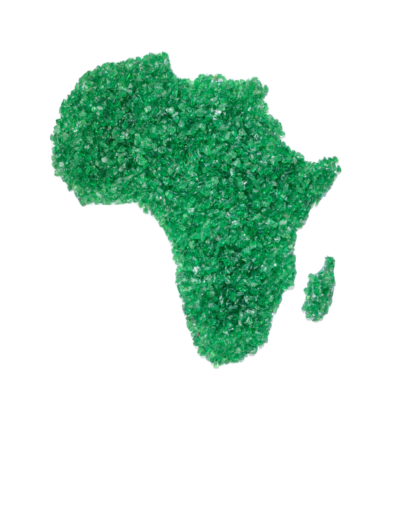 Rough tsavorite laid out in the shape of Africa.